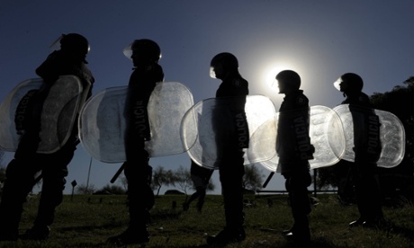 Riot police guard a supermarket attacked by food rioters in San Fernando, Buenos Aires. Photograph: Juan Mabromata/AFP/Getty Images JUAN MABROMATA/AFP/Getty Images Riot police guard a supermarket attacked by food rioters in San Fernando, Buenos Aires. Photograph: Juan Mabromata/AFP/Getty Images JUAN MABROMATA/AFP/Getty Images