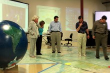 Bobbi DePorter, Anne Tolch, Steward Borie, Ward Fleri and Drew Decker exploring the world’s most accurate flat map, the Dymaxion Projection. Bobbi DePorter, Anne Tolch, Steward Borie, Ward Fleri and Drew Decker exploring